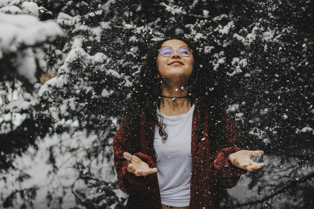 Woman smiling outside in the snow